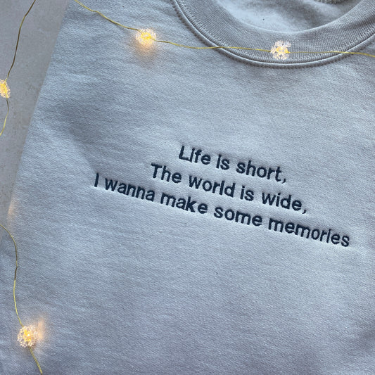 Life is short, the world is wide (text on the front and design at the back)